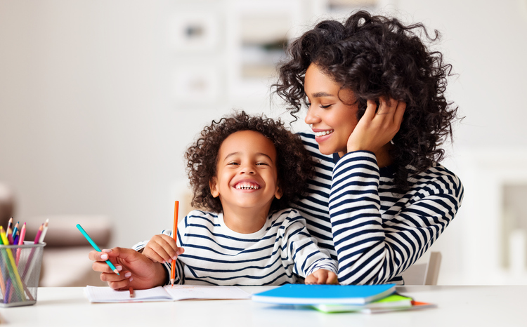 benefits of learning a second language, mother and son learning together at home.